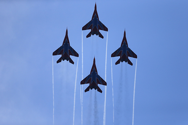 Russian aerobatic team Strizhi performs on MIG-29s during a military parade to mark 70 years since the city's liberation by the Red Army in Belgrade