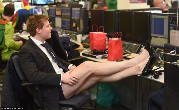 2F348E5400000578-3352323-A_trader_wearing_tiny_shorts_and_stilettos_relaxes_at_his_desk_a-a-241_1449673907862