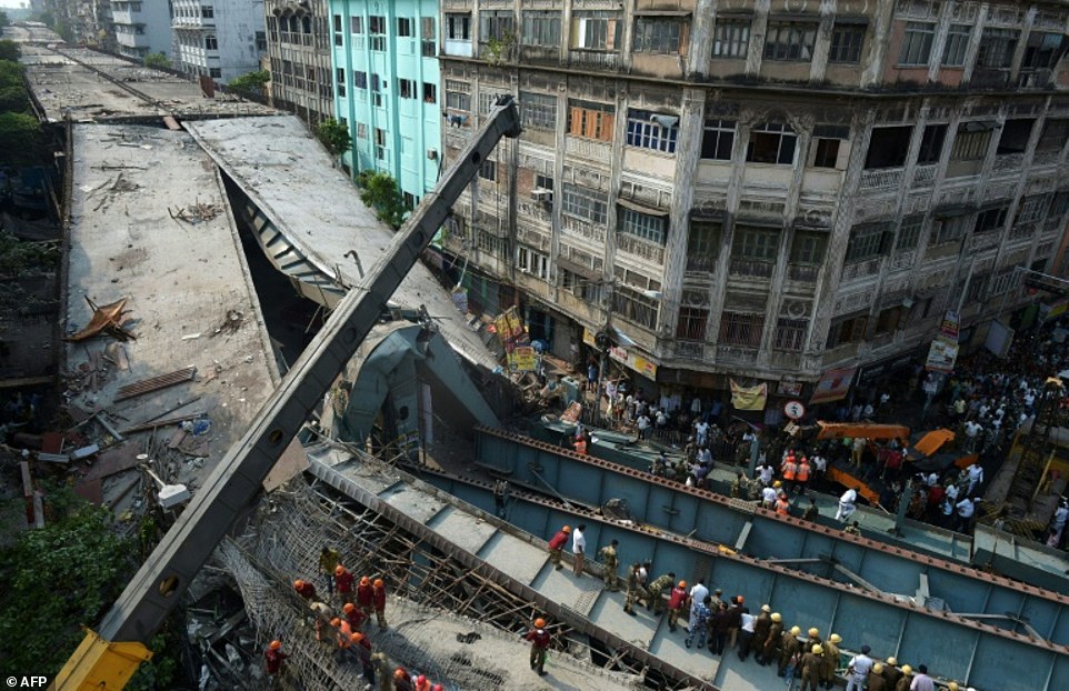11VE4KpJd4b2c7e295724d768712-3516983-The_wreckage_of_a_collapsed_flyover_in_Kolkata_India_on_March_31-a-15_1459429365033