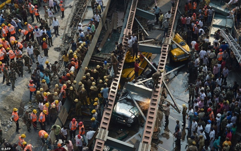3fSjtnop9G2d262e4084ea1610f5-3516983-Rescue_workers_and_volunteers_try_to_free_people_trapped_under_t-a-19_1459429489749