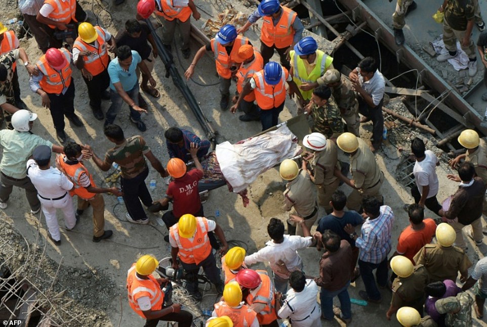 3fSjtnop9G2d262e4084ea161ff7-3516983-Indian_rescue_workers_carry_away_a_body_next_to_the_wreckage_of_-a-17_1459429436907
