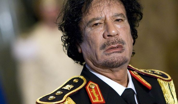 Libya's leader Muammar Gaddafi looks on during a news conference at the Quirinale palace in Rome June 10, 2009. REUTERS/Max Rossi (ITALY POLITICS HEADSHOT)