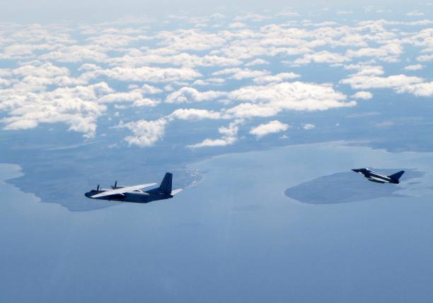 A Russian An26 Curl aircraft is shadowed by a RAF Typhoon (R). MoD/Crown Copyright/Handout via REUTERS