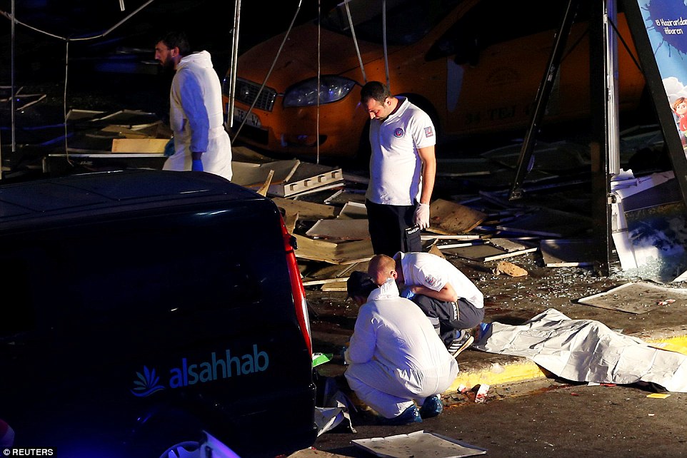35C440E200000578-3664710-Forensic_officers_work_outside_the_airport_terminal_where_three_-a-20_1467156133018
