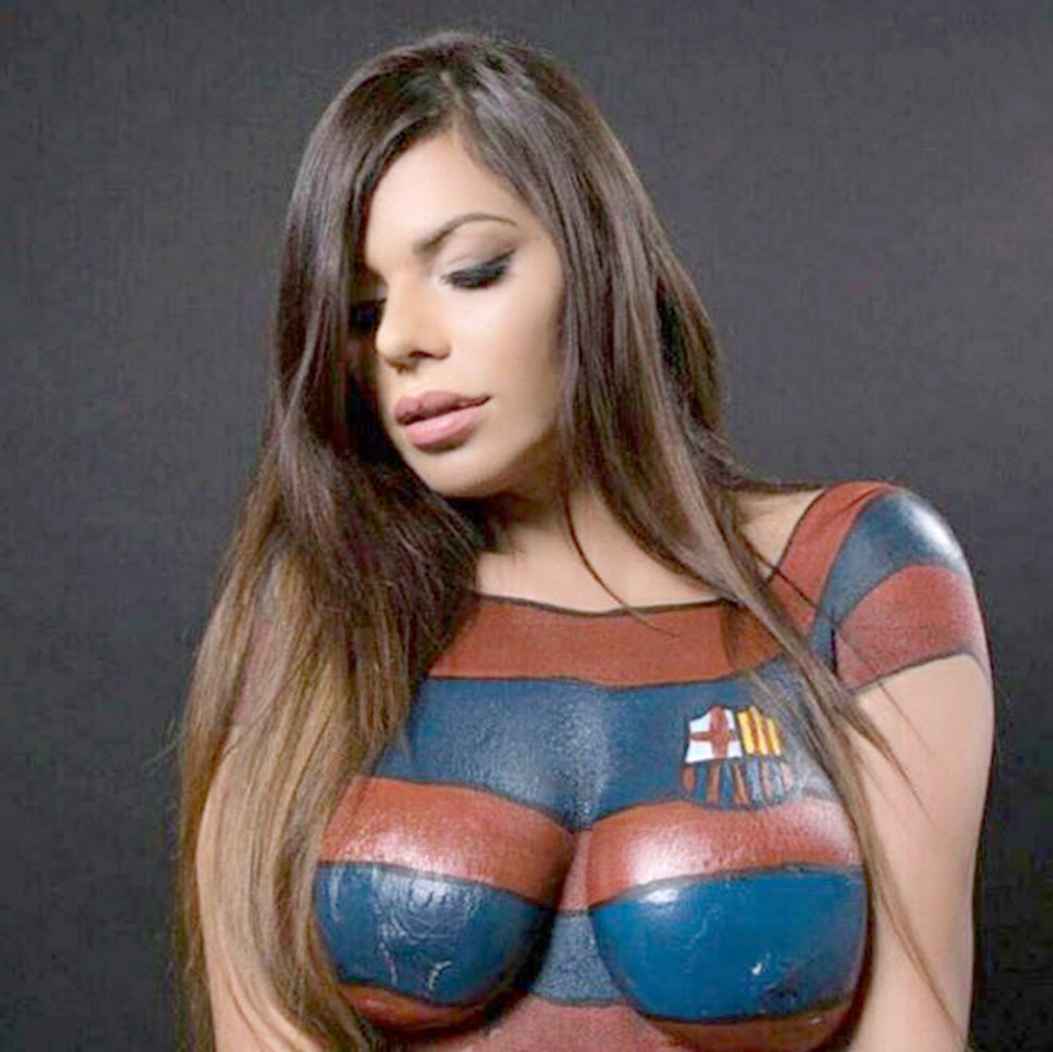 Pic shows: Suzy Cortez (25), Miss Bum Bum. When it comes to soccer strips, the reigning Miss Bum Bum is clearly ahead with her twin strikers. Model Suzy Cortez, 25 - winner of Brazil's best booty title - had herself body painted in Lionel Messi's FC Barcelona's home kit to celebrate him winning Fifa's Ballon dOr award. Superfan Suzy had earlier wished Messi luck in the competition by posting another sexy snap of herself on Instagram. Now she's convinced she's become a good luck charm for the soccer star, and is aiming to meet him face to face at the Barcelona stadium. She said on Instagram: "I want to see Camp Nou!" She told Peru's El Popular newspaper: "Im happy, I knew he was going to win. But my little help was certainly useful." (ends)