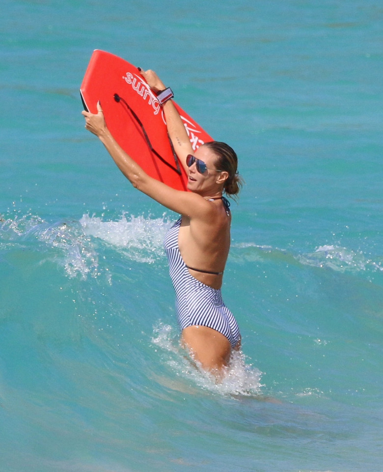 Picture Shows: Heidi Klum August 09, 2016 * Sun Online EXCL * Model and busy mum Heidi Klum and her children enjoy a day frolicking on a Caribbean beach. The family was seen relaxing on different inflatable float tubes and playing in the waves. * Sun Online EXCL * Exclusive UK RIGHTS ONLY Pictures by : FameFlynet UK ¿ 2016 Tel : +44 (0)20 3551 5049 Email : info@fameflynet.uk.com