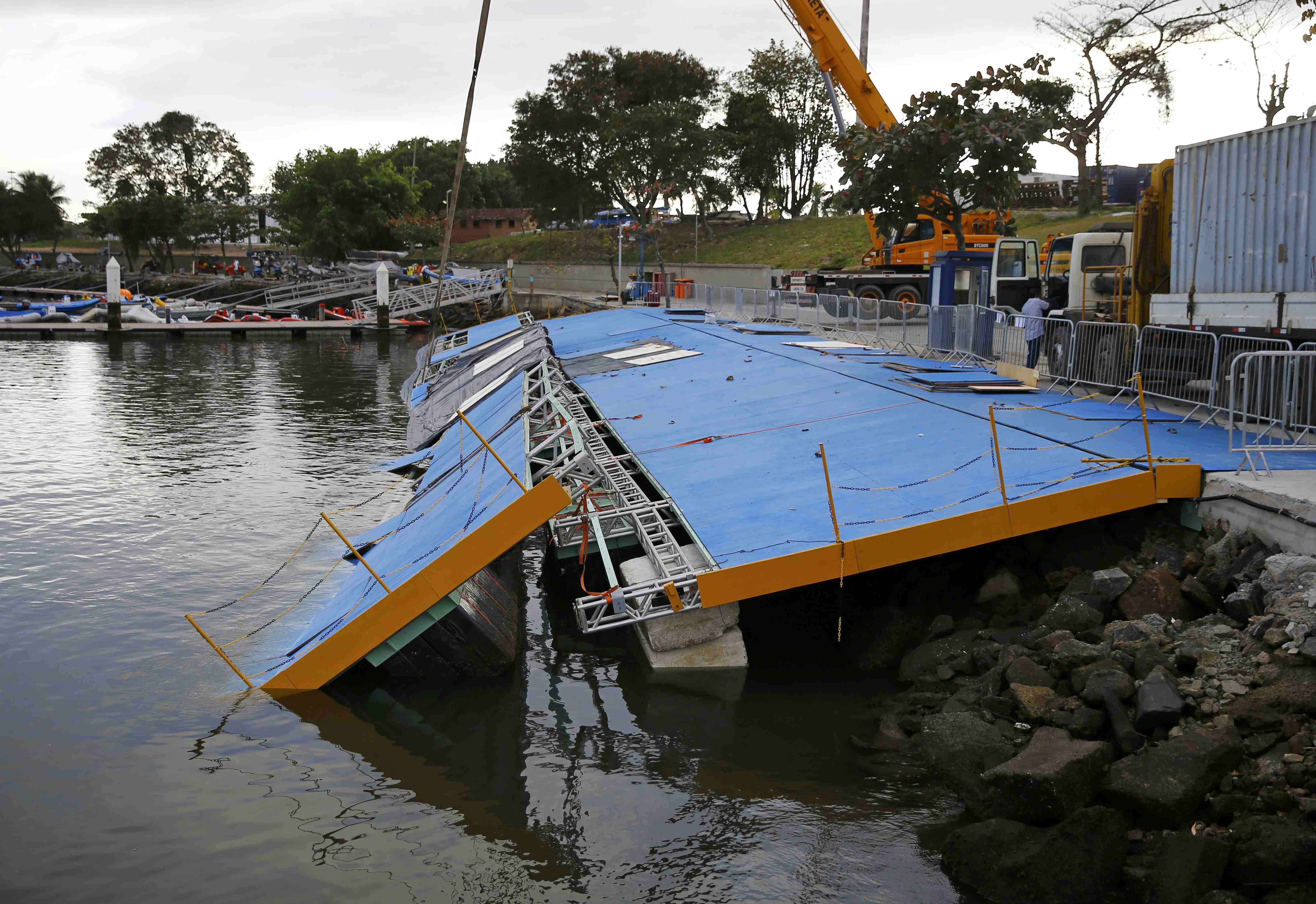 A ramp built for competitors' boats to reach the water hangs after collapsing at the Marina da Gloria sailing venue just days before the start of the Rio 2016 Olympic Gamesin Rio de Janeiro, Brazil July 31, 2016. REUTERS/Pilar Olivares