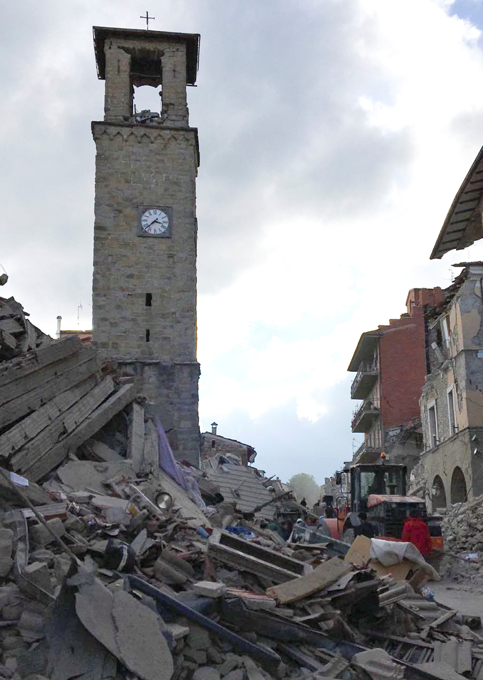 The partially damaged tower bell with the clock signing the time of the earthquake is seen in Amatrice, central Italy, August 24, 2016. REUTERS/Emiliano Grillotti   FOR EDITORIAL USE ONLY. NO RESALES. NO ARCHIVES.