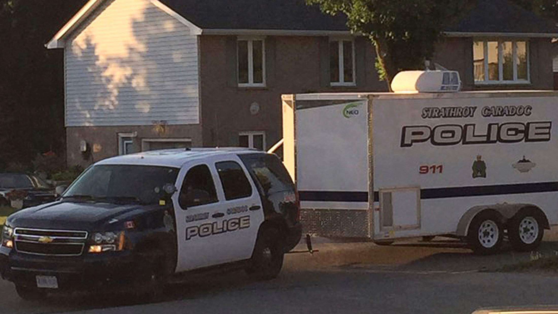 Police vehicle is parked during a raid on a home (not pictured) after they received "credible information of a potential terrorist threat" at a small community some 225 km (140 miles) southwest of Toronto in Strathroy, Ontario, Canada August 10, 2016.  REUTERS/Stringer   ATTENTION EDITORS - THIS IMAGE WAS PROVIDED BY A THIRD PARTY. EDITORIAL USE ONLY. NO RESALES. NO ARCHIVE.  THIS PICTURE WAS PROCESSED BY REUTERS TO ENHANCE QUALITY. AN UNPROCESSED VERSION HAS BEEN PROVIDED SEPARATELY.?