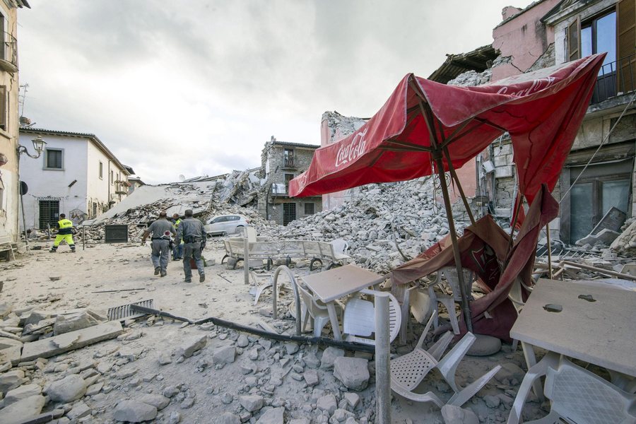 epa05508226 Search and rescue teams survey the rubble in Amatrice, central Italy, 24 August 2016, following a 6.2 magnitude earthquake, according to the United States Geological Survey (USGS), that struck at around 3:30 am local time (1:30 am GMT). The quake was felt across a broad section of central Italy, including the capital Rome where people in homes in the historic center felt a long swaying followed by aftershocks. According to reports at least 21 people died in the quake, 11 in Lazio and 10 in Marche regions.  EPA/MASSIMO PERCOSSI