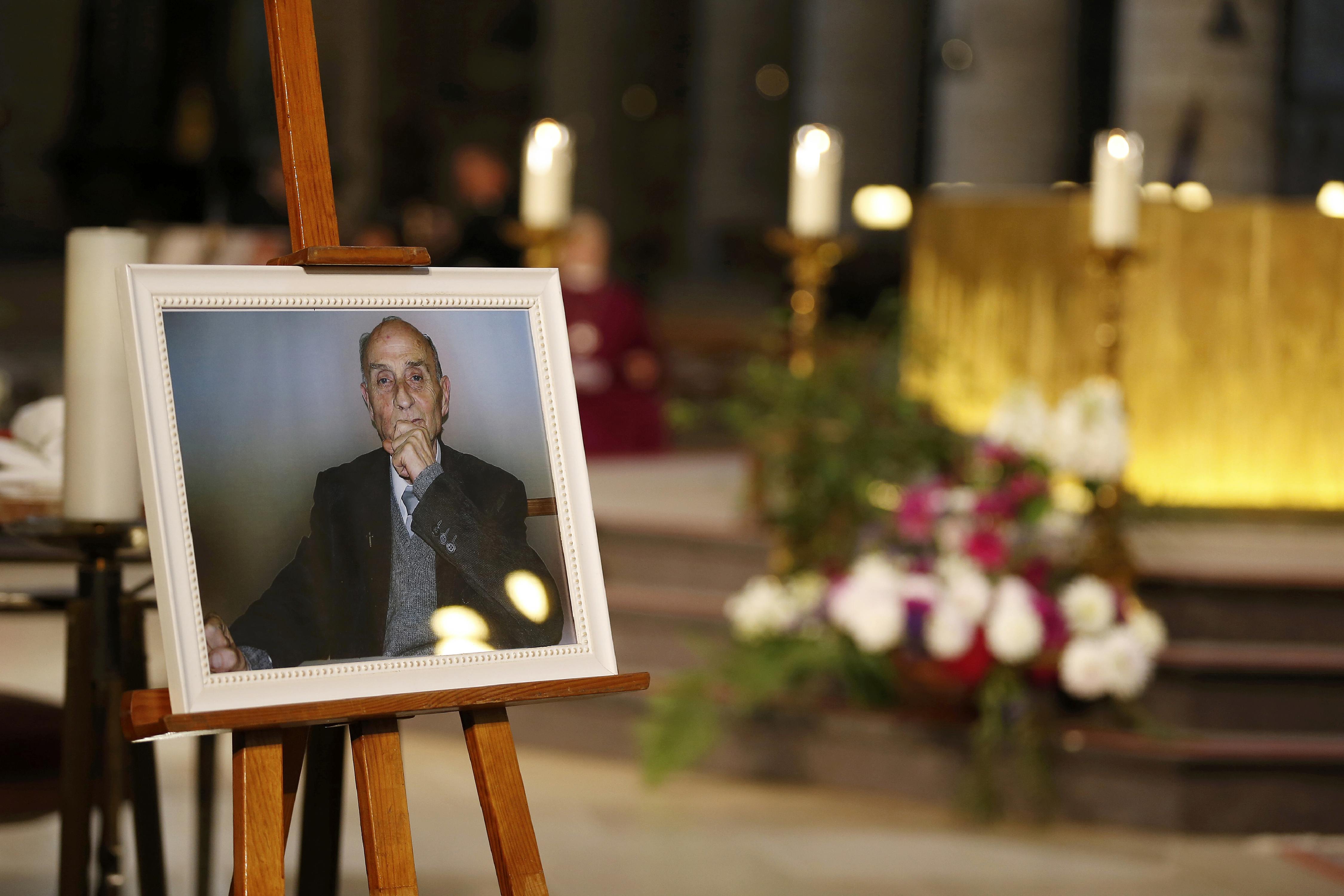 A picture of slain French parish priest Father Jacques Hamel is seen during a funeral service at the Cathedral in Rouen, France, August 2, 2016. Father Jacques Hamel was killed last week in an attack on a church at Saint-Etienne-du-Rouvray near Rouen that was carried out by assailants linked to Islamic State.   REUTERS/Charly Triballeau/Pool