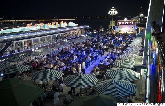 This photo taken on August 12, 2016 shows a general view of guests attending the opening of the Pyongyang Taedonggang Beer Festival on the banks of the Taedong river in Pyongyang. / AFP / Kim Won-Jin        (Photo credit should read KIM WON-JIN/AFP/Getty Images)