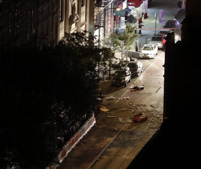 epa05545369 Debris is seen in the street in front of St. Vincent de Paul church where an explosion occurred on 23rd street between 6th and 7th Avenue in the borough of Manhattan in New York, USA, 17 September 2016. EPA/JASON SZENES