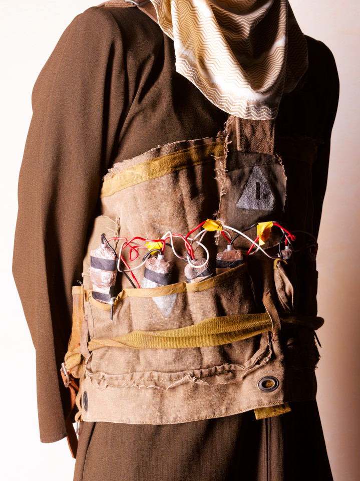 Close up of suicide bomber wearing explosive vest.