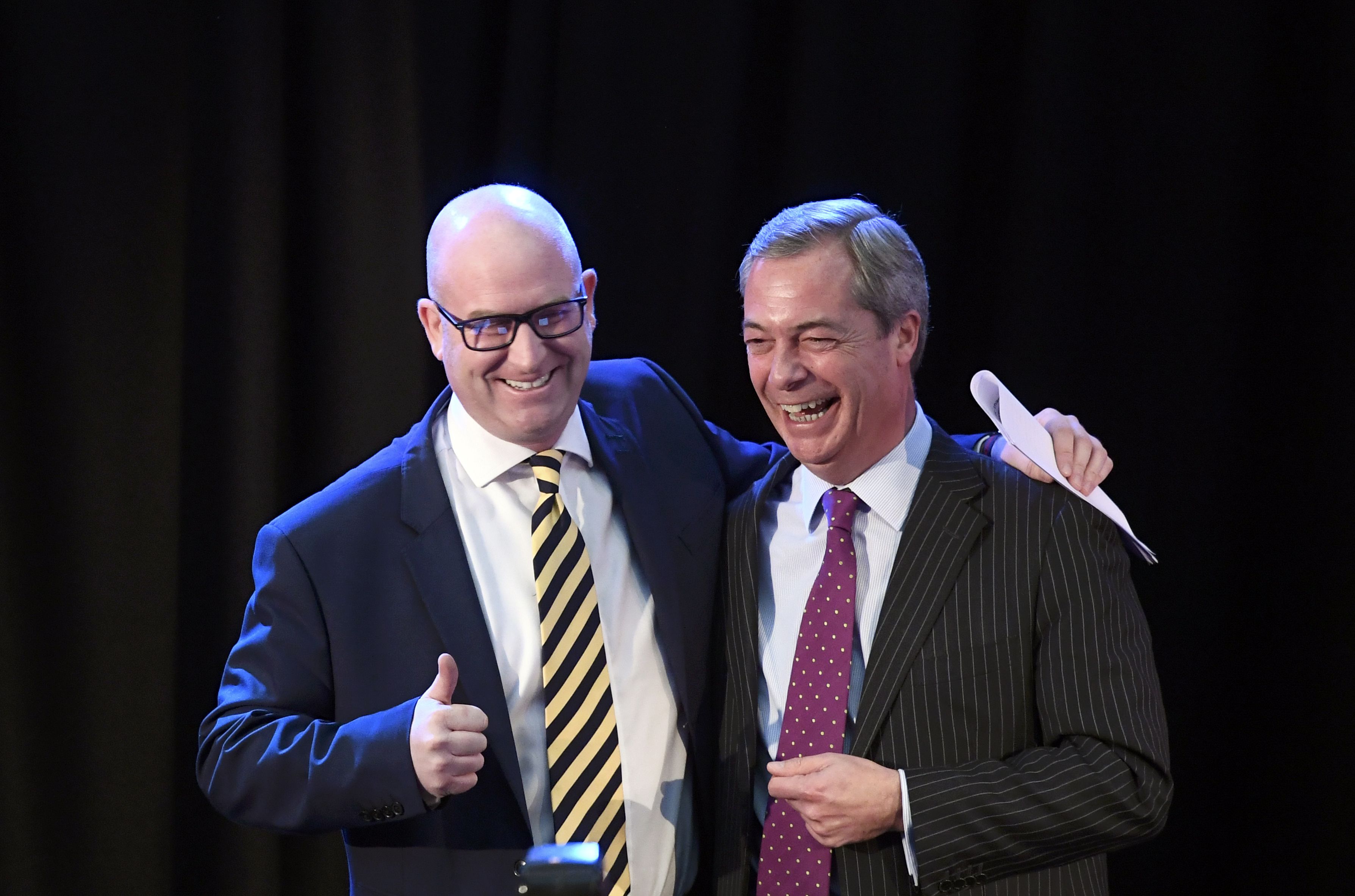 United Kingdom Independence Party (UKIP) interim leader Nigel Farage (R) embraces newly elected leader Paul Nuttall, in London, Britain November 28, 2016. REUTERS/Toby Melville