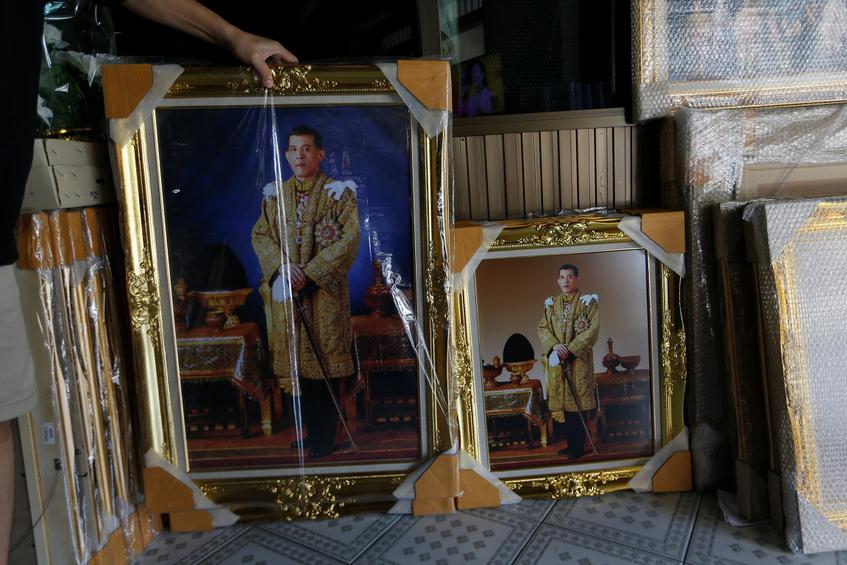 Pictures of Crown Prince Maha Vajiralongkorn are displayed for sale at a royal memorabilia shop while Thailand's parliament is set to announce his ascend to the throne after revered King Bhumibol Adulyadej passed away on October 13, in Bangkok, Thailand, November 29, 2016.  REUTERS/Jorge Silva