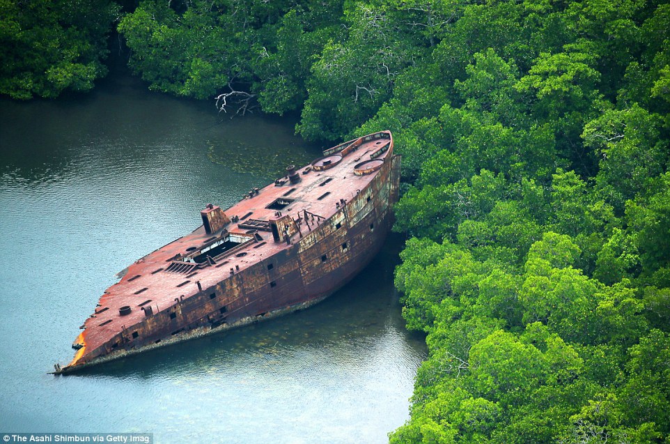 3B12022500000578-4003520-Debris_of_the_United_States_Naval_transport_vessel_remains_abond-m-76_1480982499516