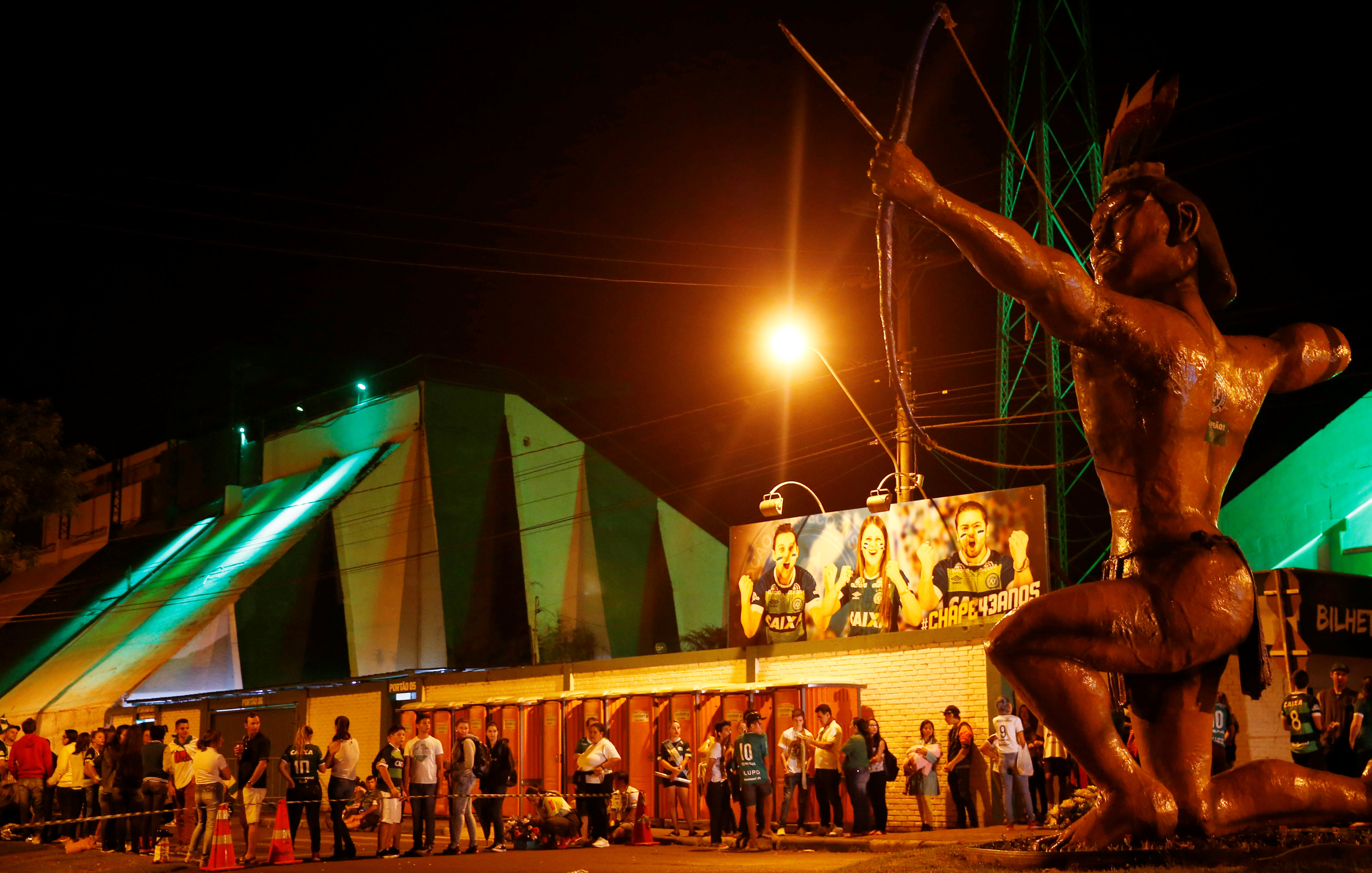 Fans of the Brazilian soccer team Chapecoense wait in front of Arena Conda stadium to receive the bodies of the victims who died in the plane crash in Colombia, in Chapeco