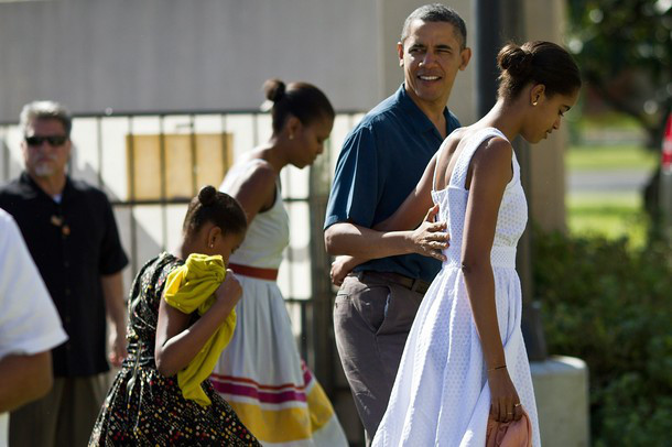 KANEOHE, HI - DECEMBER 25: (AFP OUT) U.S. President Barack Obama, First Lady Michelle Obama and daughters Malia and Sasha Obama enter the Marine Corps Base Hawaii Chapel December 25, 2011 in Kaneohe, Hawaii. Obama is spending the Christmas holiday in his native Hawaii with his family. (Photo by Kent Nishimura-Pool/Getty Images)