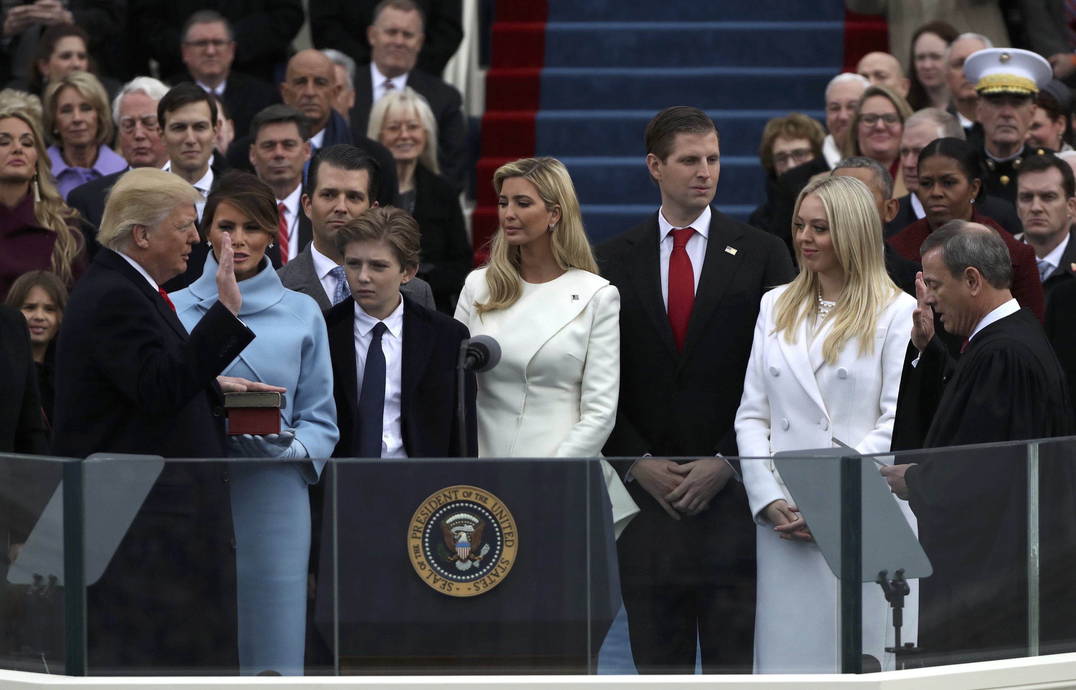 U.S. President Donald Trump (L) takes the oath of office from U.S. Supreme Court Chief Justice John Roberts (R) with his wife Melania, and children Barron, Donald, Ivanka and Tiffany at his side during inauguration ceremonies at the Capitol in Washington, U.S.,  January 20, 2017. REUTERS/Carlos Barria
