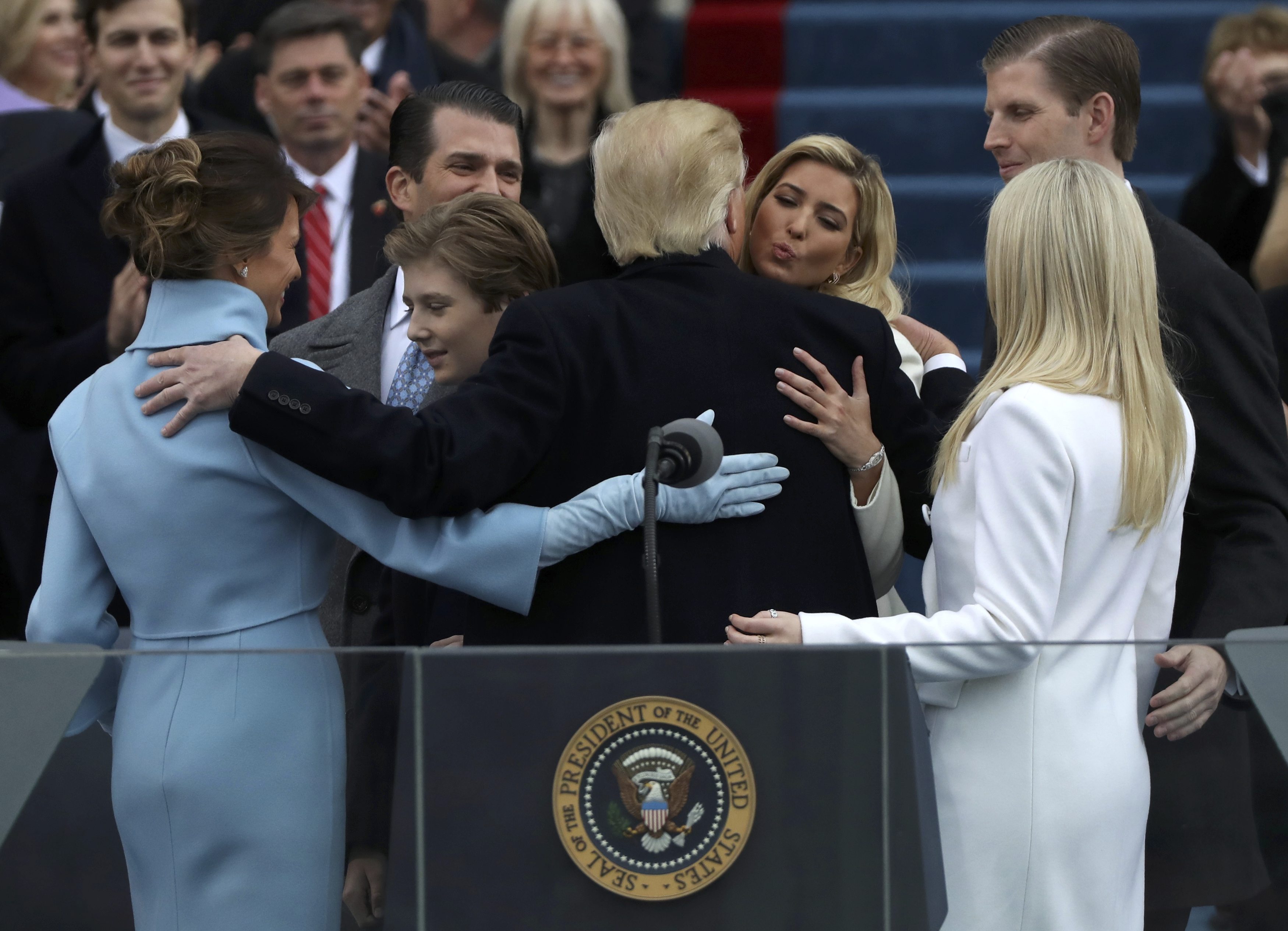 U.S. President Donald Trump embraces members of his family, wife Melania (L), and children Barron, Donald, Ivanka and Tiffany,after being sworn in during inauguration ceremonies at the Capitol in Washington, U.S.,  January 20, 2017. REUTERS/Carlos Barria