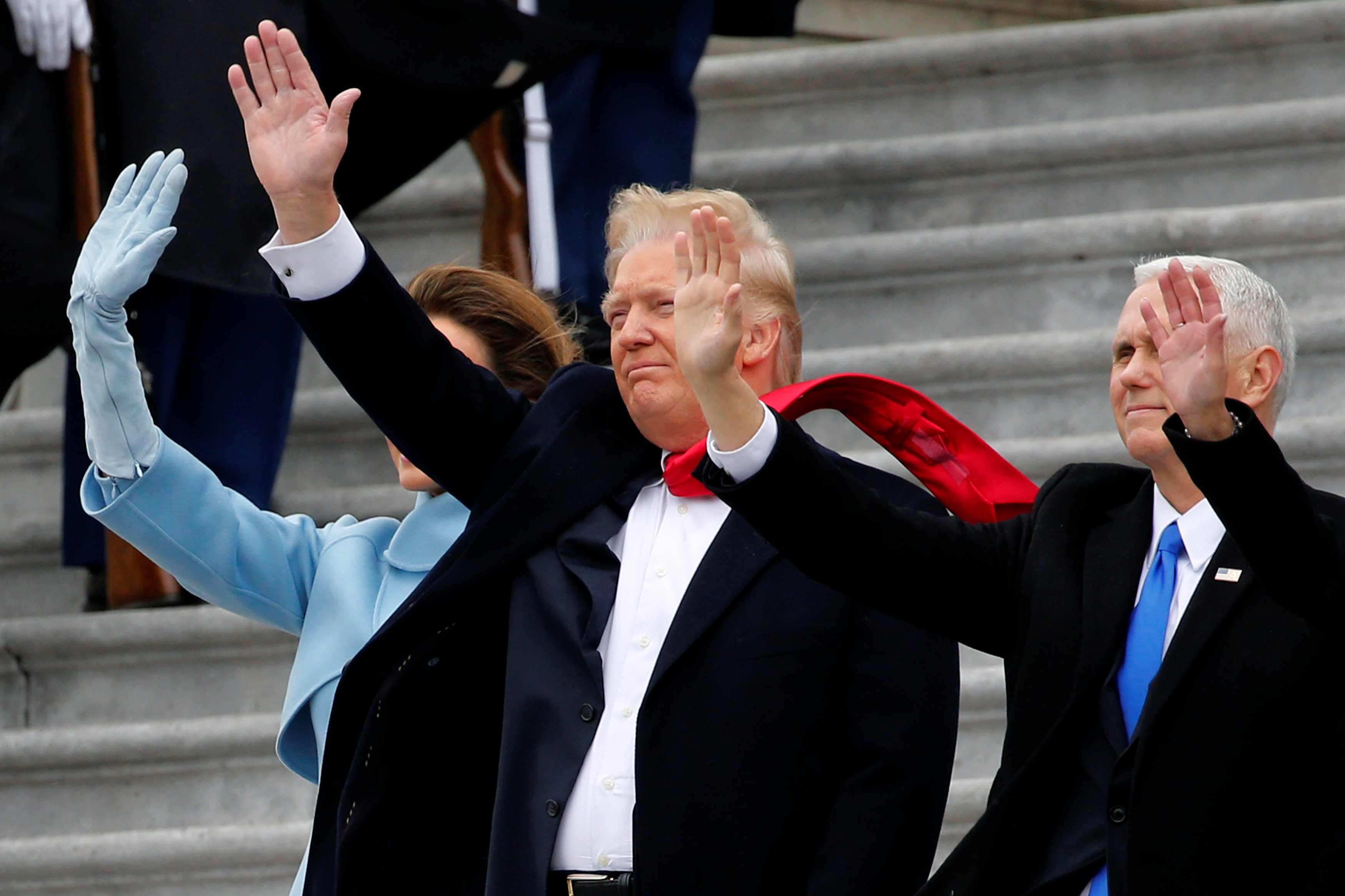 U.S. President Donald Trump and Vice President Mike Pence wave goodbye to former U.S. President Barack Obama and his wife Michelle Obama as they depart following Trump's inauguration at the Capitol in Washington, U.S. January 20, 2017. REUTERS/Jonathan Ernst
