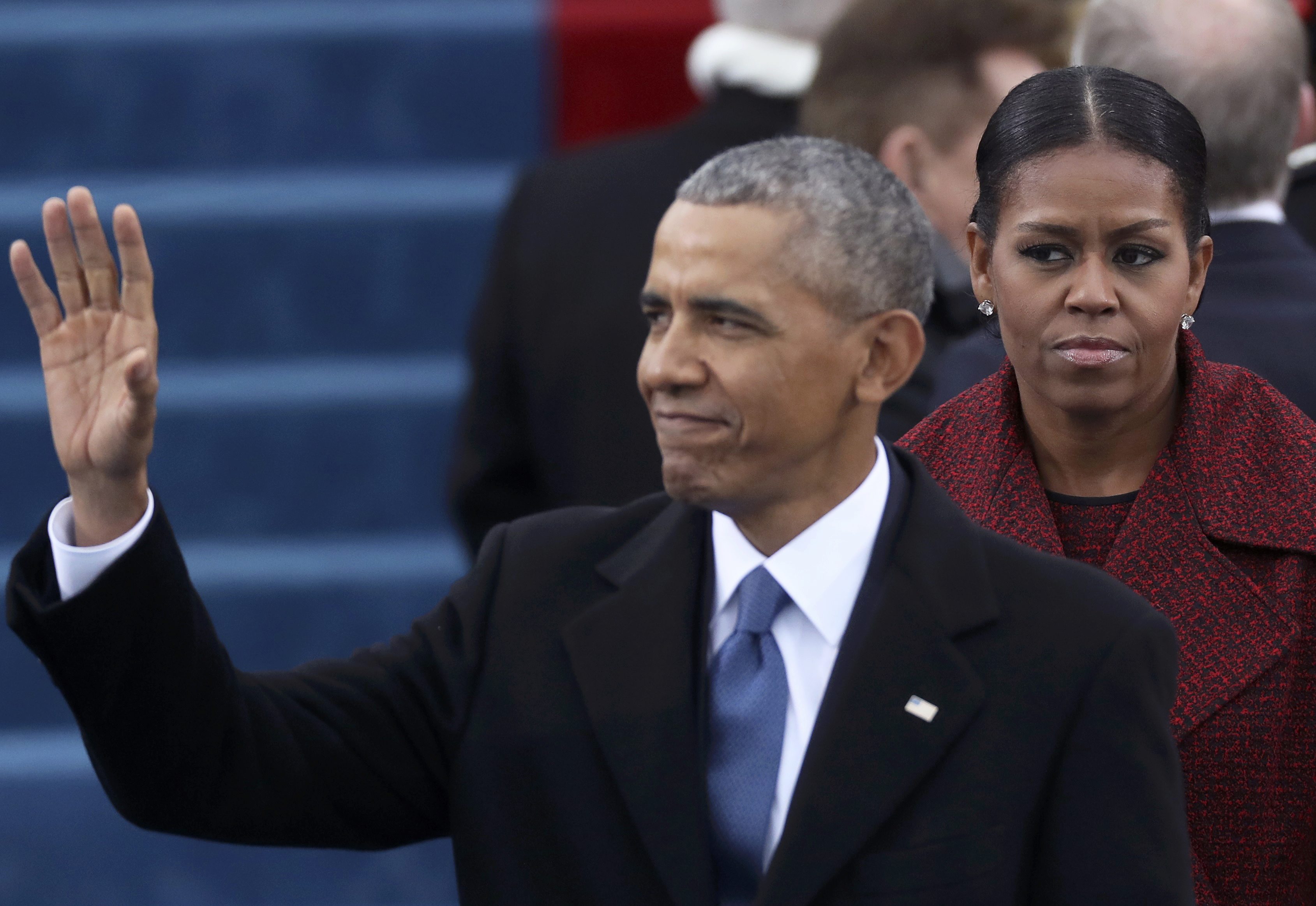 President Barack Obama and First Lady Michelle Obama (R) look on at inauguration ceremonies swearing in Donald Trump as the 45th president of the United States on the West front of the U.S. Capitol in Washington, U.S., January 20, 2017.  REUTERS/Carlos Barria