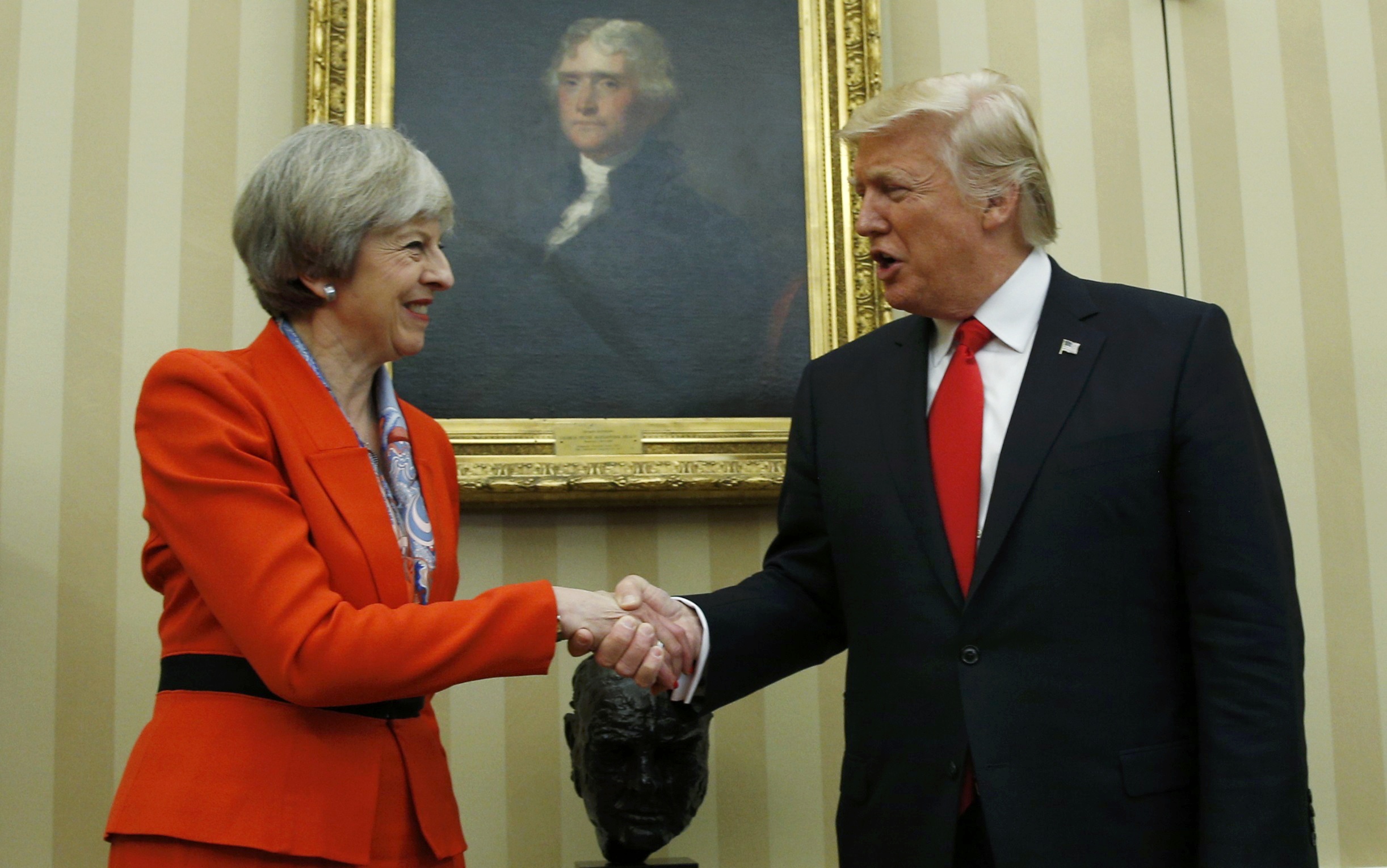 U.S. President Donald Trump greets British Prime Minister Theresa May in the White House Oval Office in Washington, U.S., January 27, 2017.  REUTERS/Kevin Lamarque