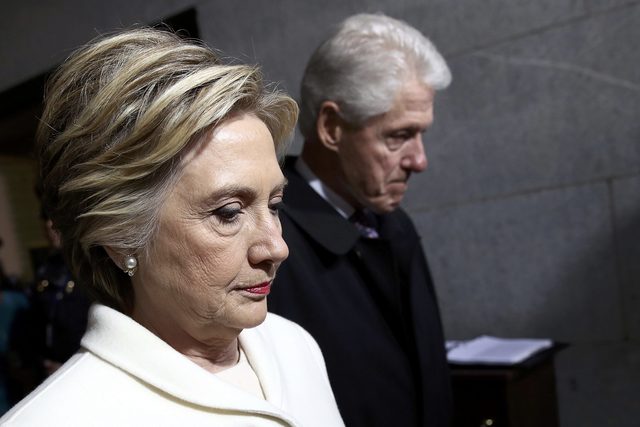Former Democratic presidential nominee Hillary Clinton (L) and former President Bill Clinton arrive on the West Front of the U.S. Capitol in Washington, D.C., U.S., January 20, 2017. REUTERS/Win McNamee/Pool