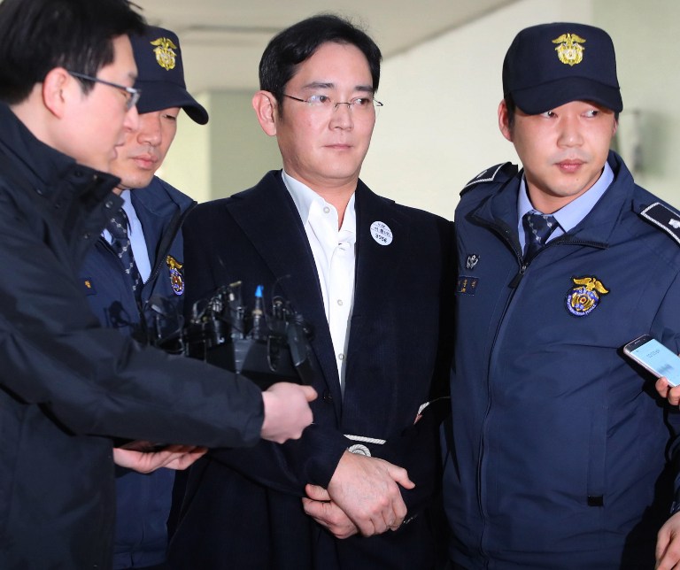 Samsung Group's heir-apparent Lee Jae-Yong. Handcuffed and bound with ropes, the heir of electronics giant Samsung appeared for questioning on February 18 over his alleged involvement in the corruption scandal currently engulfing South Korean President Park Geun-Hye.