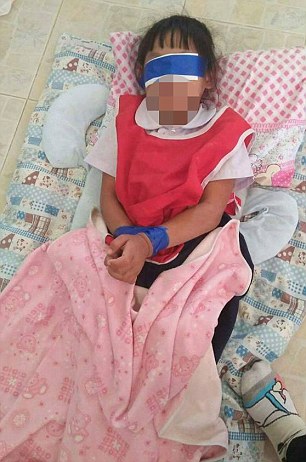 VIRAL PRESS - NEWS COPY - WITH PICTURES - 07771706292 These shocking pictures show how two five-year-old girls were bound and blindfolded with Scotch tape because they were not concentrating in class. The two pupils - who have not been identified - received the cruel punishment in front of classmates after ripping paper - sparking a furious reaction from the two female teachers last week. Pictures of the pair taken by a third teacher were handed to parents of the girls earlier this week and the school defended the teachers - with the headmaster saying it was a good way to teach them how to concentrate. But after the images sparked outrage online and a father of one of the girls contacted police, the two teachers have since been ordered to pay 40,000THB (915GBP) in compensation and authorities have launched an urgent investigation into the school in Surin, Thailand. The furious father said: ëíThe teacher who gave me the pictures told me that the other teachers had punished my daughter and friend by strapping their hands together then he blindfolded them. ëíWe think that another girl was hit but we donít have a picture of this. The children were just playing with the paper and they ripped it. The teachers said they had done something wrong and punished them like this. ëíThey said ëclose your eyesí and then they put white paper and blue Scotch tape to cover their eyes. Then another layer and bound their hands together. ëíThe teacher who found them said the girls were crying, trembling and sobbing terribly. I fear that I will have to send to the police. ëíThe teachers threatened them and both were frightened and did not know what else to do.'' A crisis meeting was held was held yesterday (Thu) which was attended by the headmaster, the parents, the two female teachers responsible and local police. Each teacher agreed to pay 20,000THB (457GBP) in compensation and requested transfers to different schools. Narong Meuanchart, the deputy education department chief in the province, said a committee had been set up to investigate the abuse and the pair could face further legal action. ENDS (FEE: 40 for 1st pictyure, 20 for 2nd)