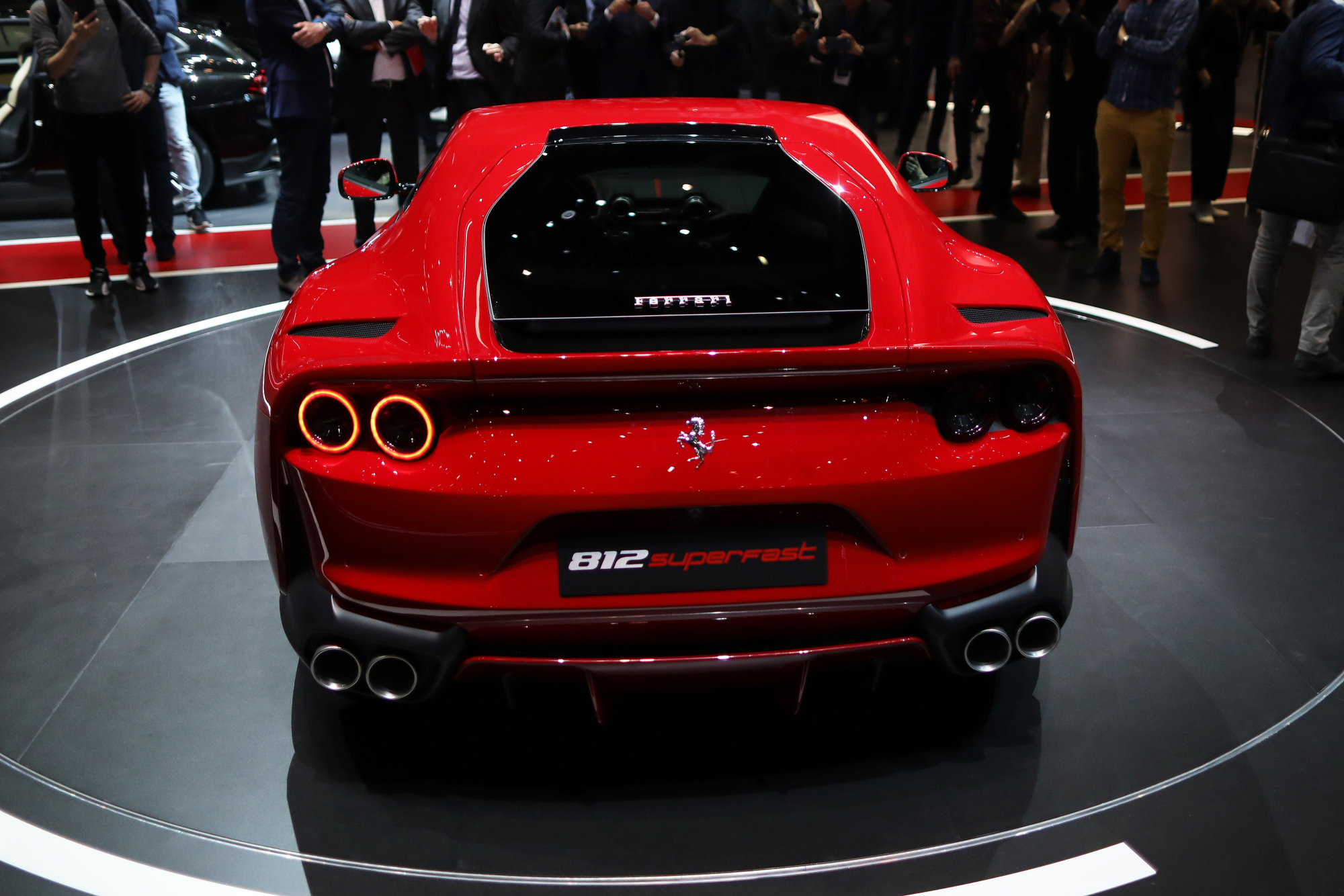 A Ferrari NV 812 Superfast luxury automobile stands on display