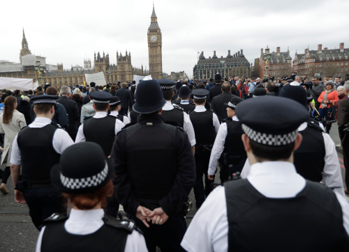 Police officers take part in a commemorative event to mark last week's attack outside Parliament that killed four people on Westminster Bridge in London, Wednesday, March 29, 2017. (AP Photo/Matt Dunham)