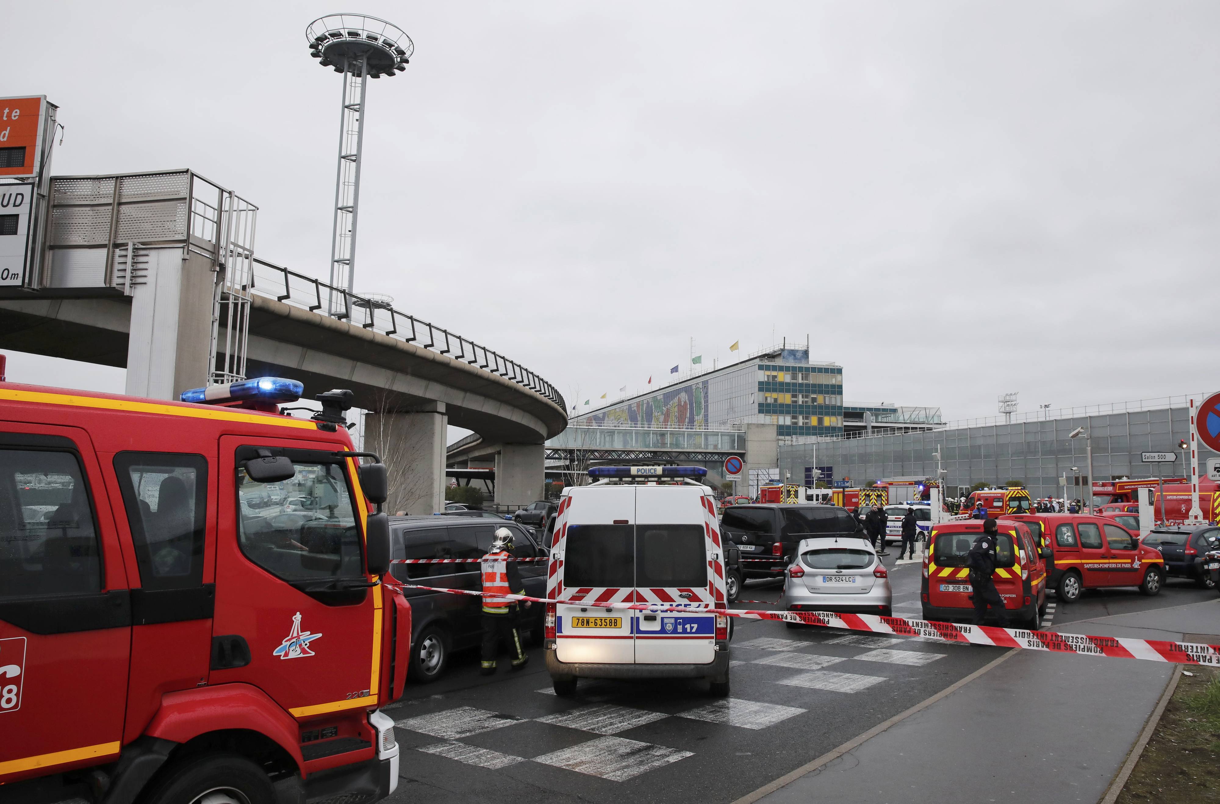 General view of emergency vehicles at Orly airport southern terminal after shooting incident near Paris