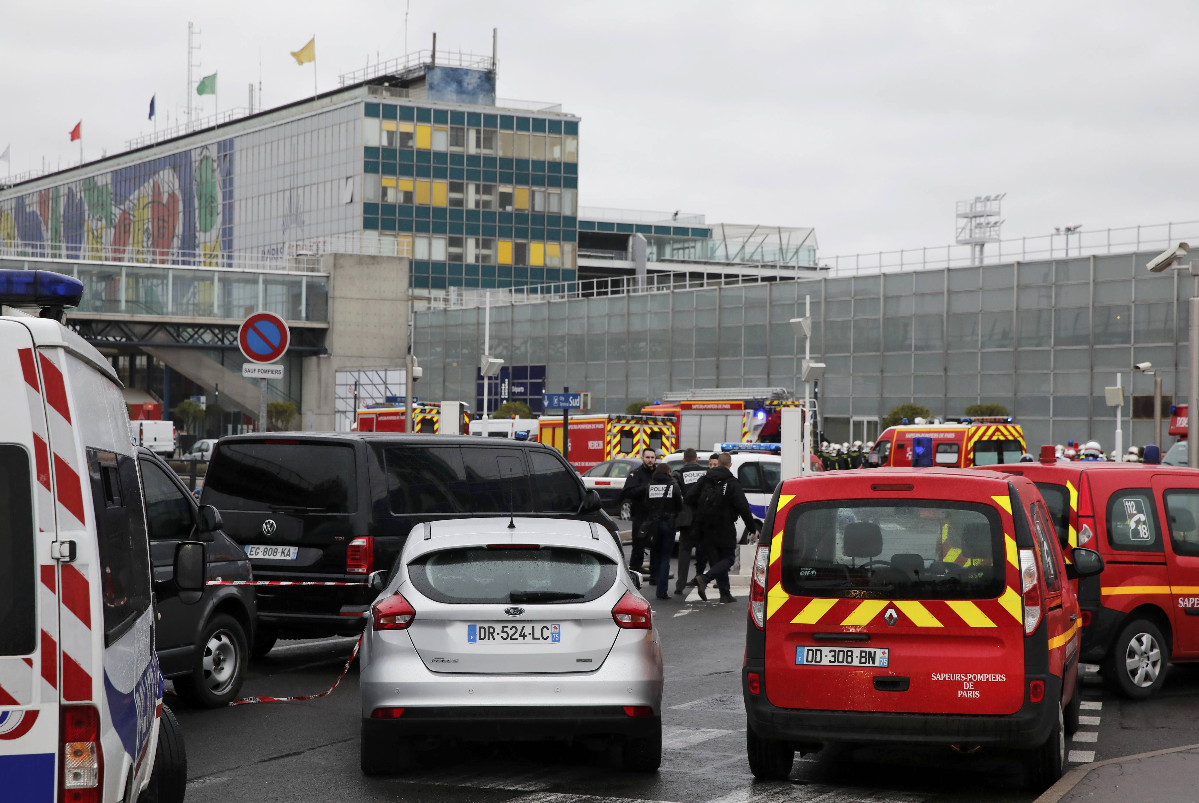 General view of emergency vehicles at Orly airport southern terminal after shooting incident near Paris