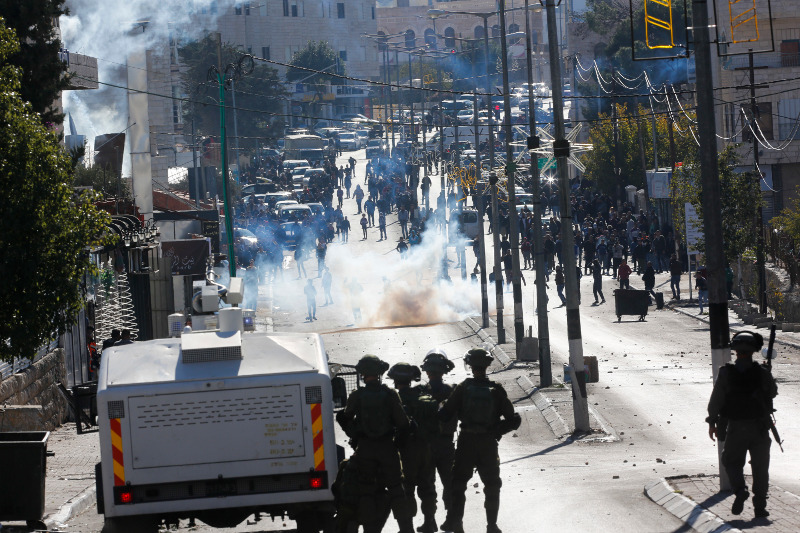 Palestinians clash with Israeli troops during a protest against U.S. President Donald Trump's decision to recognize Jerusalem as the capital of Israel in the West Bank city of Bethlehem, Friday, Dec.8, 2017.(AP Photo/Nasser Shiyoukhi)