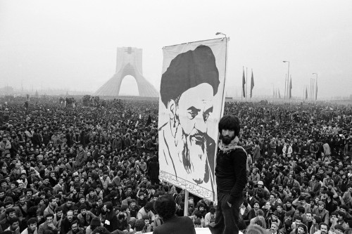 Demonstrators hold up a poster of exiled Shiite Muslim leader Ayatollah Khomeini during an anti-shah demonstration in Tehran, the Iranian capital, on Dec. 10, 1978. The Iranian revolution in 1979 had a powerful effect on the wider Muslim world, particularly among Shiites.