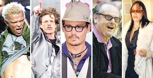 «–¡ - ”’Õ¡’À…¡ "FASHION ROCKS" ”‘« Õ≈¡ ’œ— «. ”‘« ÷Ÿ‘œ œ ‘—¡√œ’ƒ…”‘«” Ã–…À… ¡⁄Õ‘œÀ. Rock star Billy Idol lefts up his shirt as he performs during the "Fashion Rocks" concert Thursday, Sept. 8, 2005 in New York's Radio City Music Hall. Proceeds from the concert will be donated to Hurricane Katrina relief. (AP Photo/Jeff Christensen)