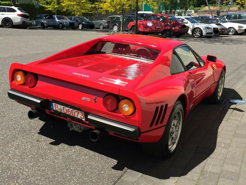 The Monday, May 13, 2019 photo provided by the police in Duesseldorf shows the Ferrari 288 GTO. German police have recovered a valuable 1980s Ferrari stolen during a test drive and are now searching for the man who is believed to have sped off with the car while posing as a would-be buyer. The red Ferrari 288 GTO, first registered in 1985, is believed to be worth more than 2 million euros ($2.2 million). (Police Duesseldorf via AP)