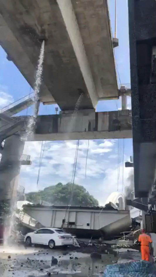 A view of debris and the collapsed Nanfang'ao Bridge is seen after a typhoon hit Su'ao in Yilan county, Taiwan, October 1, 2019, in this still image from video obtained via social media. Xinmei Live Seafood via REUTERS ATTENTION EDITORS - THIS IMAGE HAS BEEN SUPPLIED BY A THIRD PARTY. MANDATORY CREDIT. NO RESALES. NO ARCHIVES.