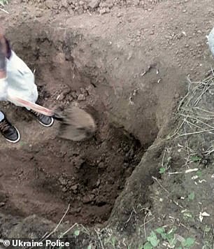 22010154-7772493-It_took_Ukrainian_police_about_five_hours_to_dig_up_the_bodies-a-49_1575902408760