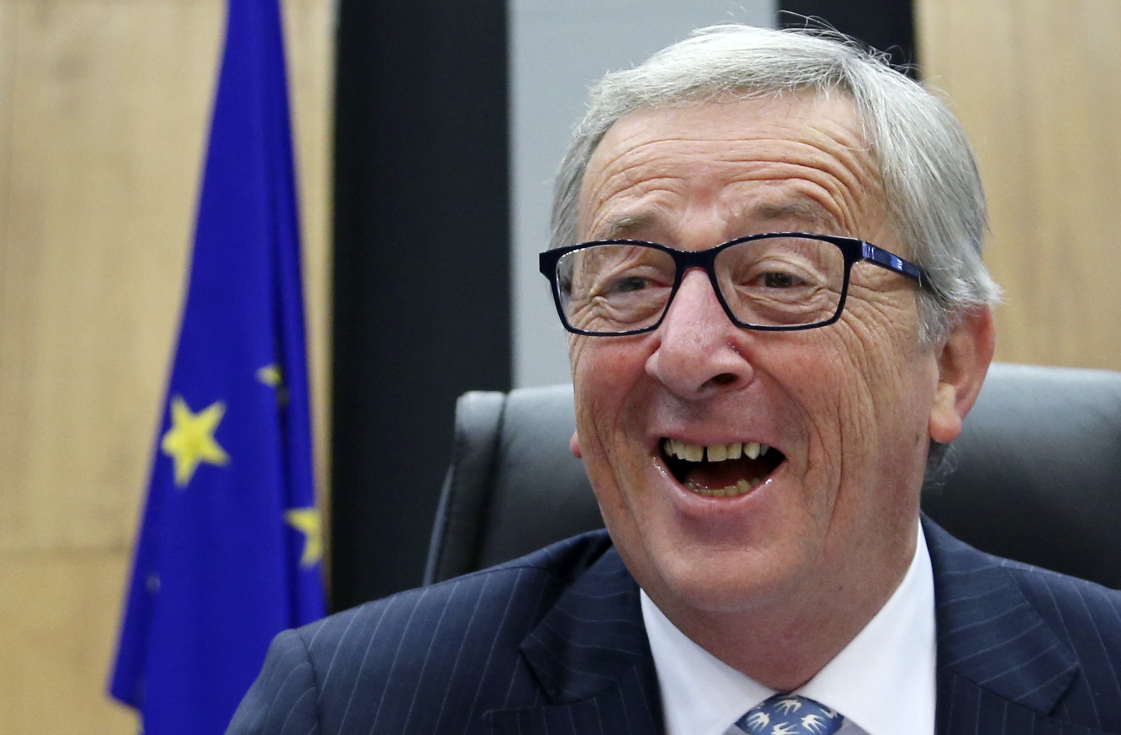 The European Commission's new President Juncker reacts as he chairs the first official meeting of the EU's executive body in Brussels