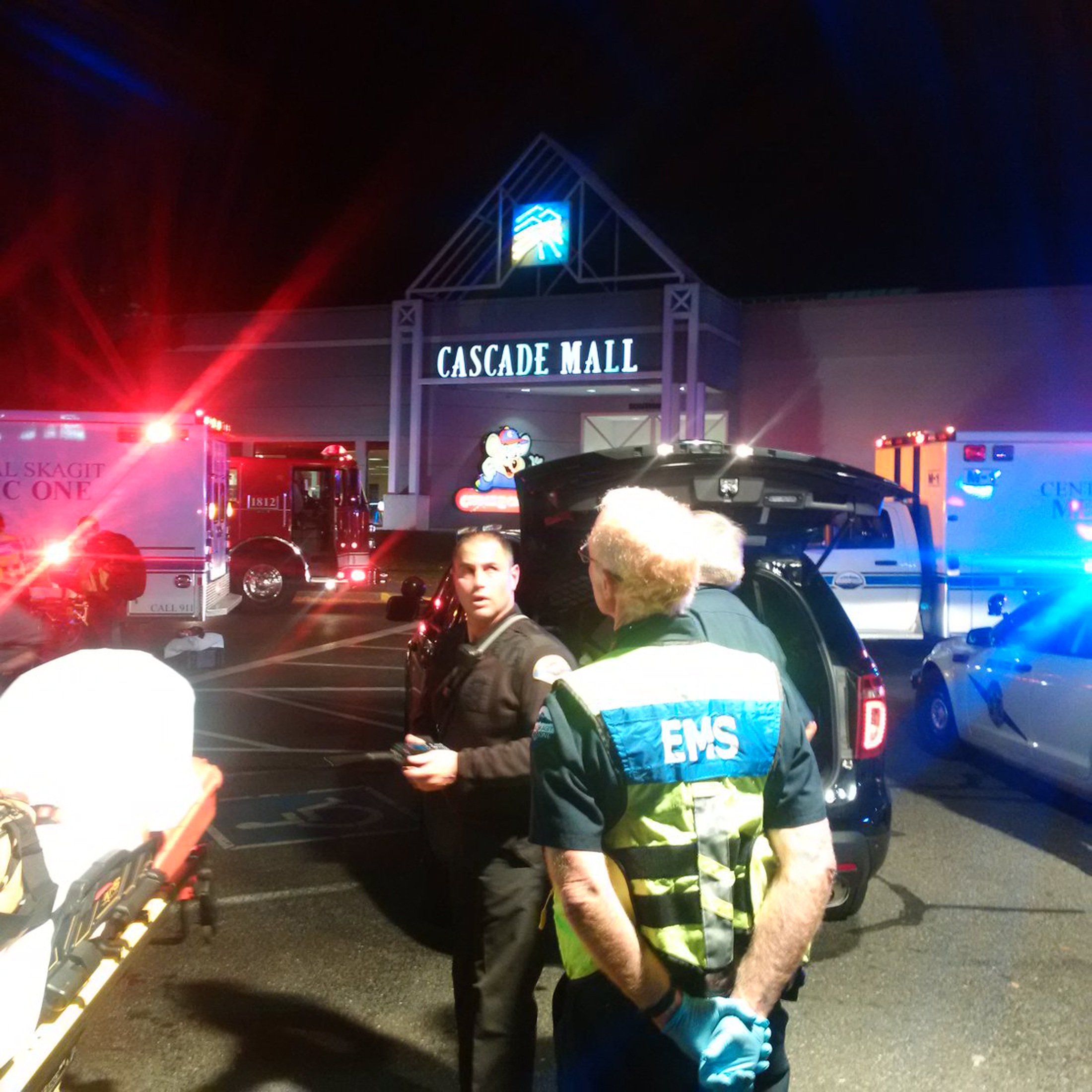 Medics wait to gain access to the Cascade Mall after four people were shot dead in Burlington, Washington, U.S. September 24, 2016. Sgt Mark Francis/Washington State Patrol/Handout via Reuters ATTENTION EDITORS - THIS IMAGE WAS PROVIDED BY A THIRD PARTY. EDITORIAL USE ONLY. FOR EDITORIAL USE ONLY. NOT FOR SALE FOR MARKETING OR ADVERTISING CAMPAIGNS. THIS IMAGE HAS BEEN SUPPLIED BY A THIRD PARTY. IT IS DISTRIBUTED, EXACTLY AS RECEIVED BY REUTERS, AS A SERVICE TO CLIENTS