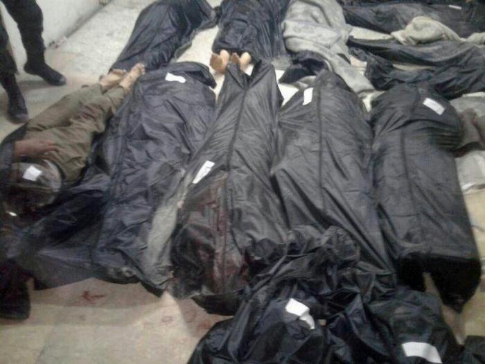 ATTENTION EDITORS - VISUALS COVERAGE OF SCENES OF DEATH Covered dead bodies lie on the ground after Islamic State fighters killed 20 people in the village of Aqarib al-Safi, east of Hama city, Syria in this handout picture provided by SANA on May 18, 2017. SANA/Handout via REUTERS ATTENTION EDITORS - THIS IMAGE WAS PROVIDED BY A THIRD PARTY. EDITORIAL USE ONLY. REUTERS IS UNABLE TO INDEPENDENTLY VERIFY THIS IMAGE. TEMPLATE OUT