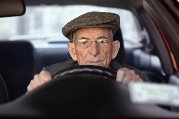 A-senior-man-driving-a-car
