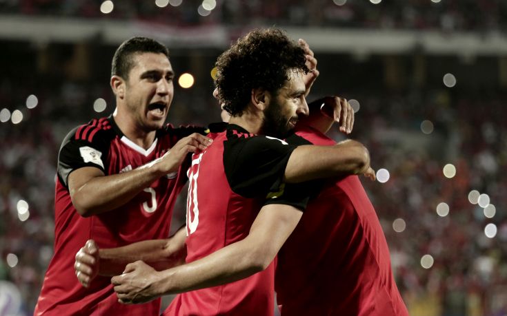 Egypt's Mohamed Salah, center, celebrates with his teammates after defeating Congo during the 2018 World Cup group E qualifying soccer match between Egypt and Congo at the Borg El Arab Stadium in Alexandria, Egypt, Sunday, Oct. 8, 2017. Egypt won 2-1. (AP Photo/Nariman El-Mofty)