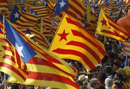 Marchers wave Catalonian nationalist flags as they demonstrate during Catalan National Day in Barcelona, September 11, 2012. REUTERS/Gustau Nacarino