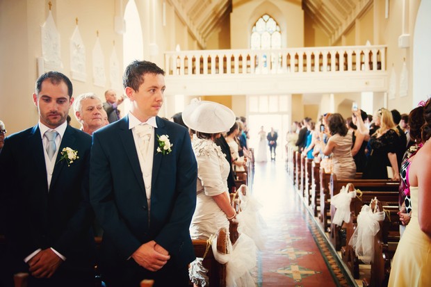 Kilshane-House-Wedding-Photography-Ireland-groom-at-altar-and-bride-entering-church