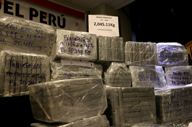 Peruvian police display to the press more than two tonnes of cocaine hidden in packages of asparagus destined for Amsterdam, after arresting a Serbian man and four Peruvians suspected of running a smuggling operation from a gourmet food business, authorities said, at police headquarters in Lima, Peru, January 12, 2017. REUTERS/Mariana Bazo