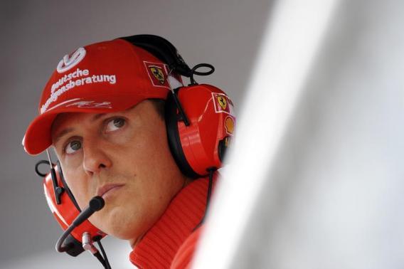 Former Ferrari driver Michael Schumacher of Germany looks on during the qualifying session for the Italian F1 Grand Prix race at the Monza racetrack in Monza, near Milan, in this September 13, 2008 file photo. REUTERS/Alessandro Bianchi